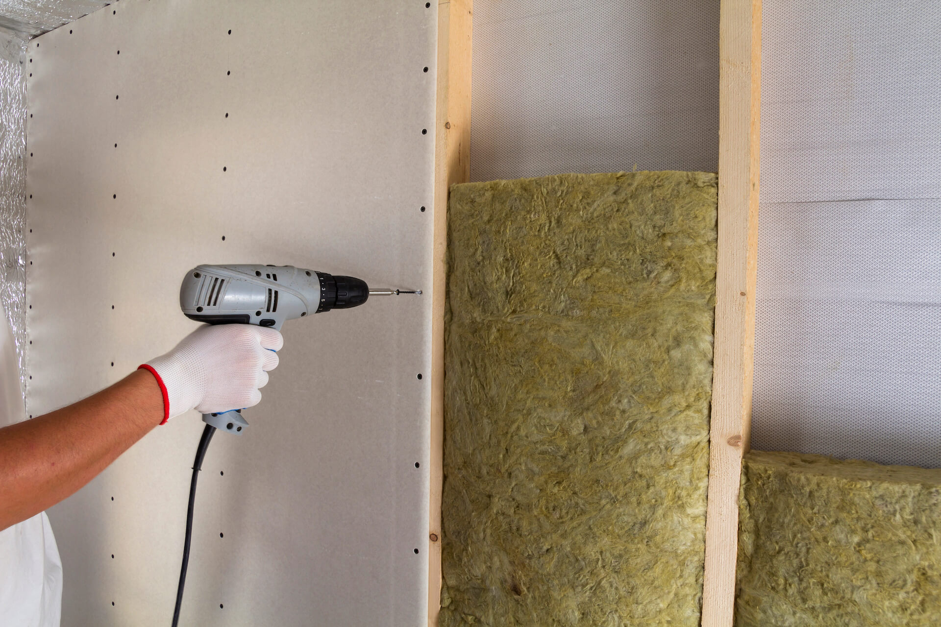 close-up-of-worker-hand-with-electric-screwdriver-2022-02-23-02-23-08-utc